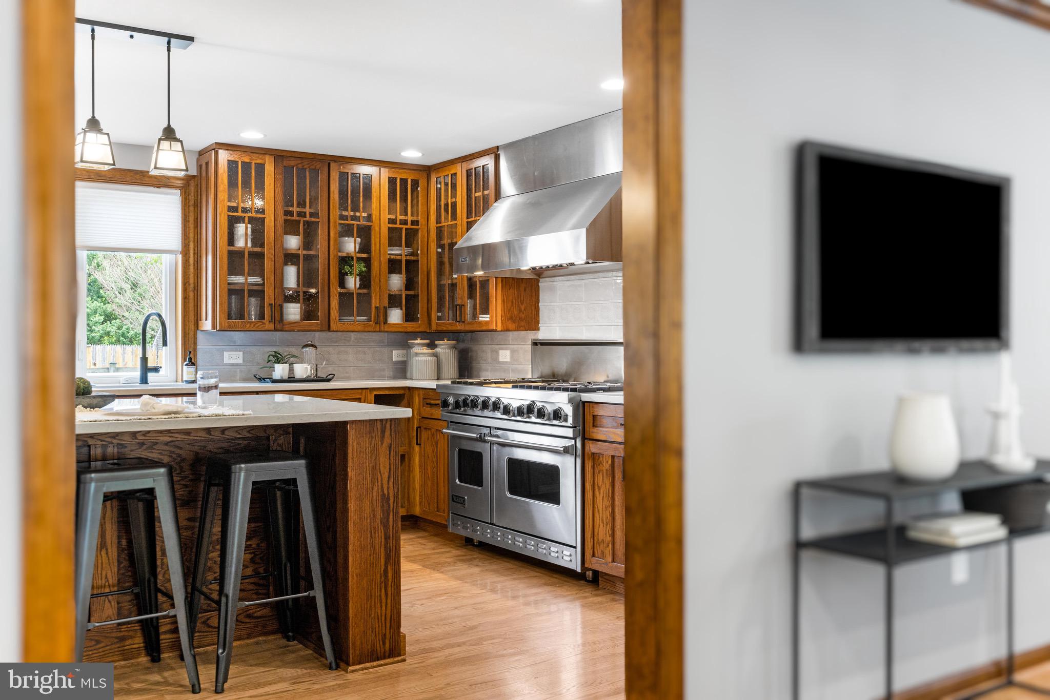 8735 Doves Fly Way Laurel, MD 20723 - Photo 18 of 64 a kitchen with a stove and a microwave