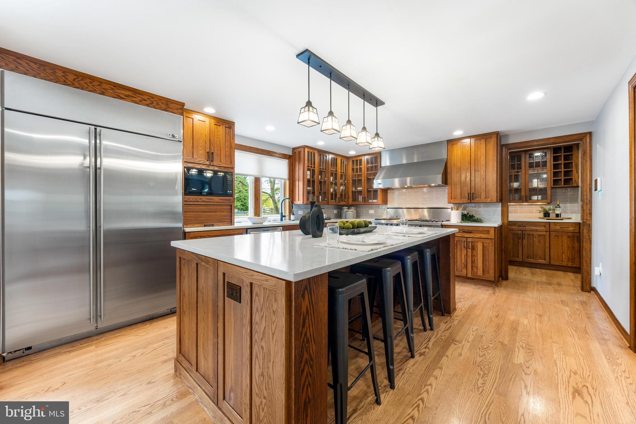8735 Doves Fly Way Laurel, MD 20723 - Photo 2 of 64 a kitchen with stainless steel appliances granite countertop a sink and a refrigerator