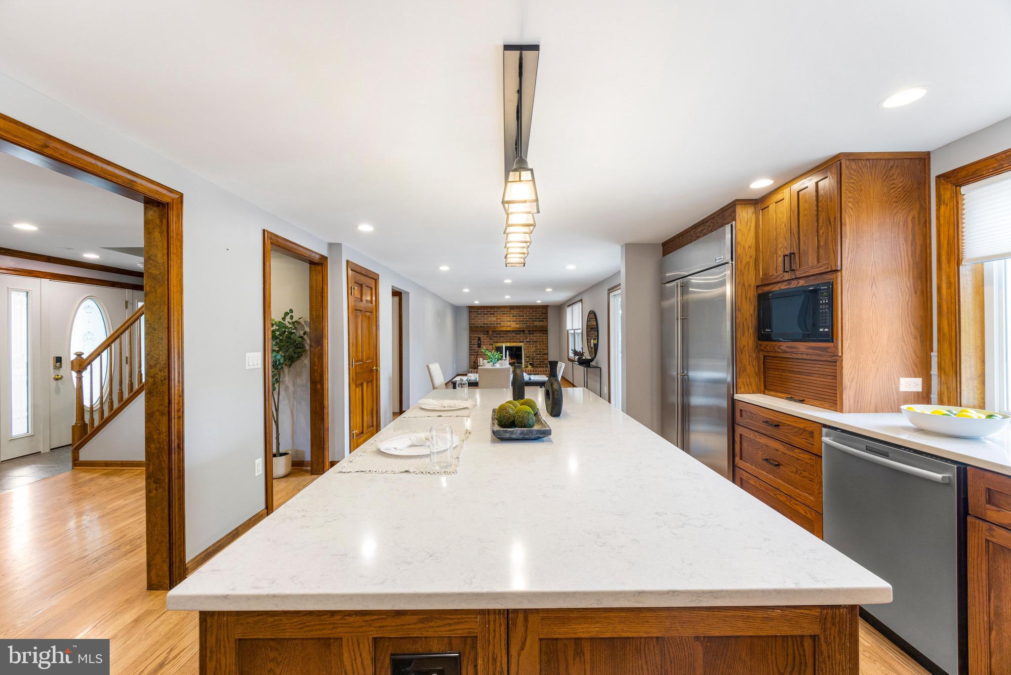 8735 Doves Fly Way Laurel, MD 20723 - Photo 22 of 64 a view of a dining room with furniture window and wooden floor