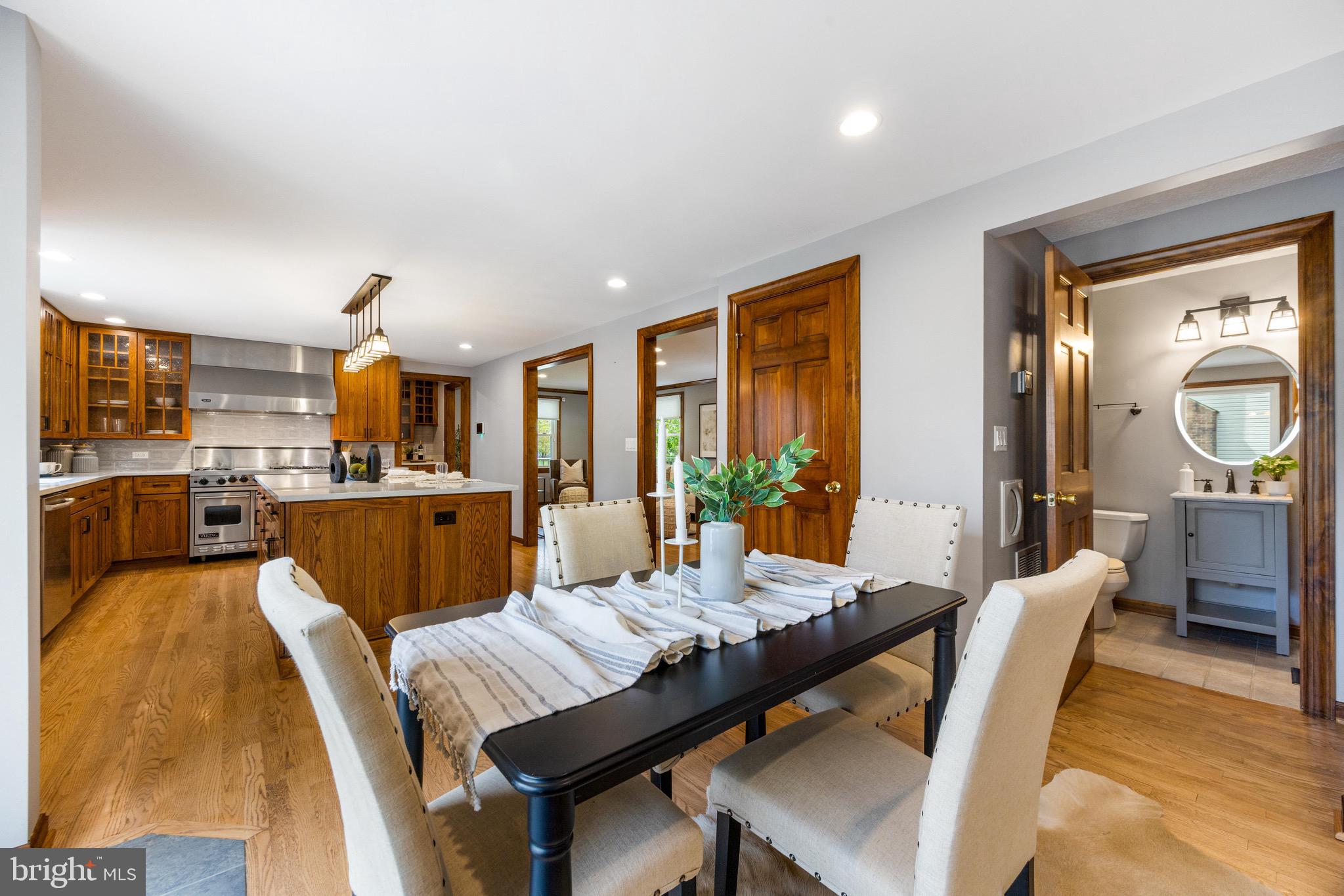 8735 Doves Fly Way Laurel, MD 20723 - Photo 28 of 64 a view of a dining room with furniture window and wooden floor