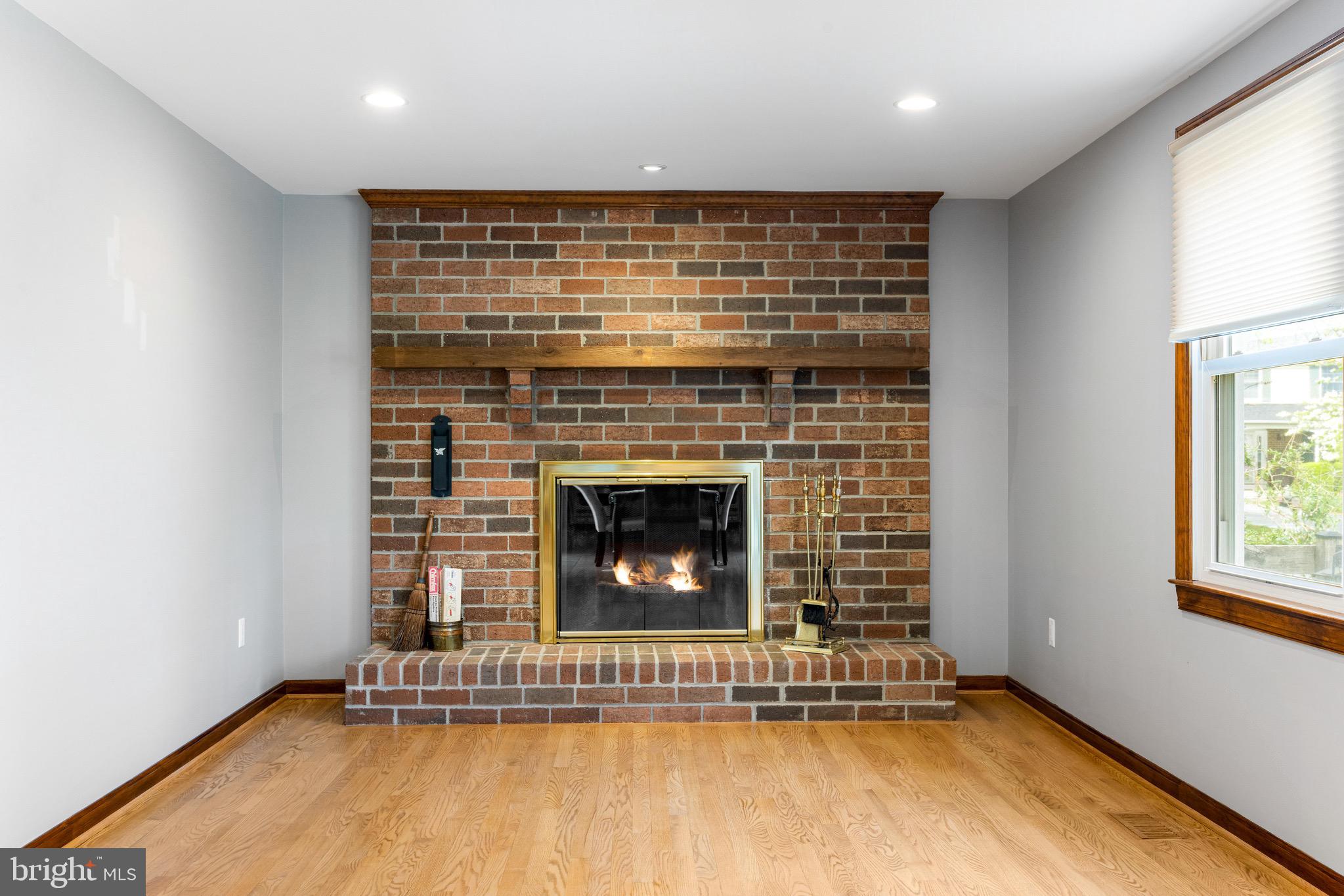 8735 Doves Fly Way Laurel, MD 20723 - Photo 30 of 64 a view of an empty room with a fireplace