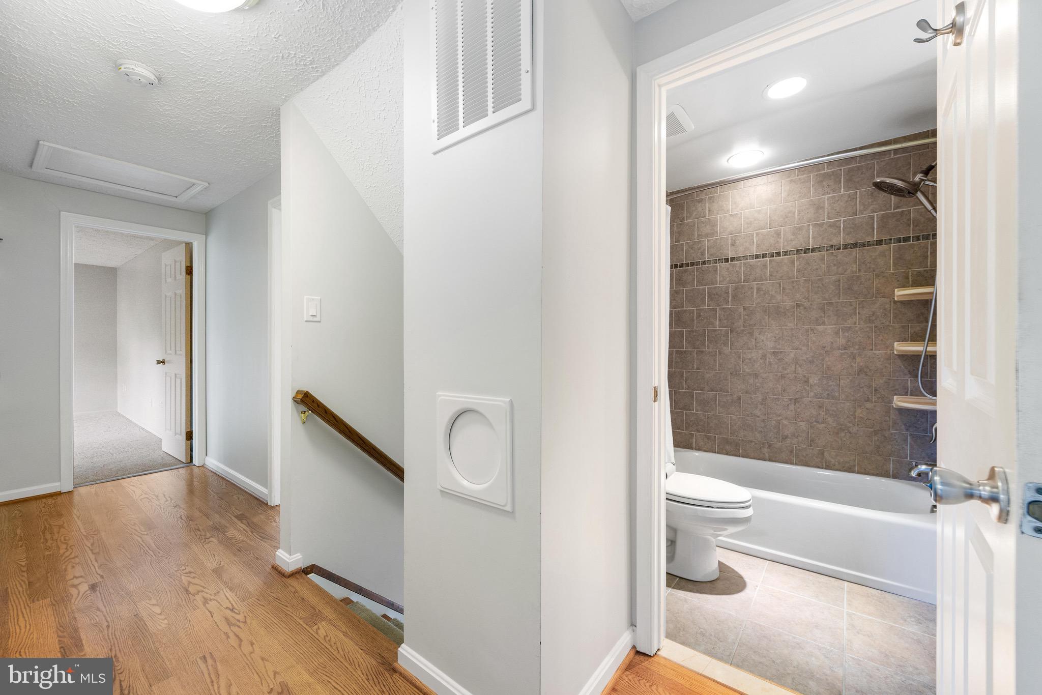 8735 Doves Fly Way Laurel, MD 20723 - Photo 40 of 64 a bathroom with a shower and a toilet