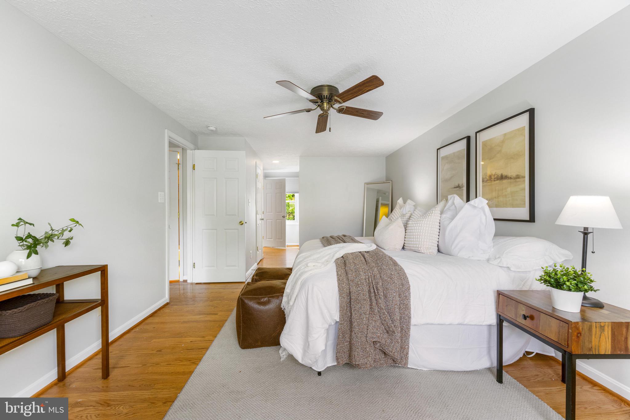 8735 Doves Fly Way Laurel, MD 20723 - Photo 44 of 64 a spacious bedroom with a bed and window