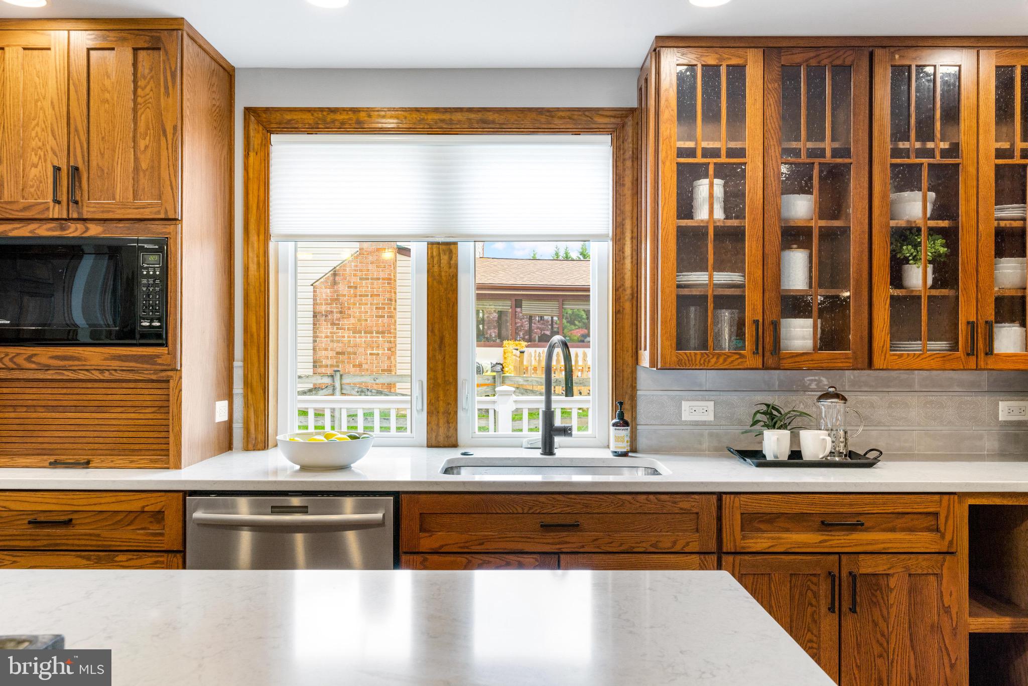 8735 Doves Fly Way Laurel, MD 20723 - Photo 5 of 64 a large kitchen with granite countertop a sink and a window