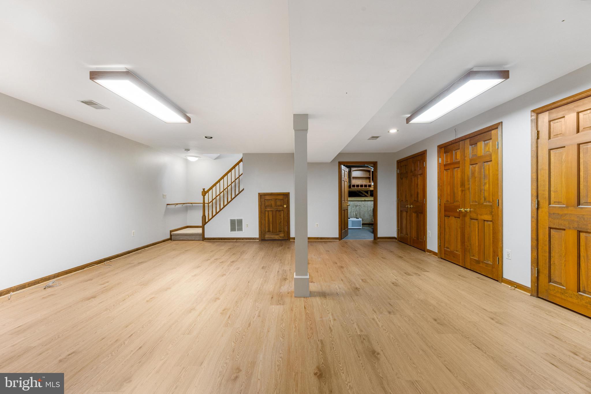 8735 Doves Fly Way Laurel, MD 20723 - Photo 55 of 64 an empty room with windows and cabinet