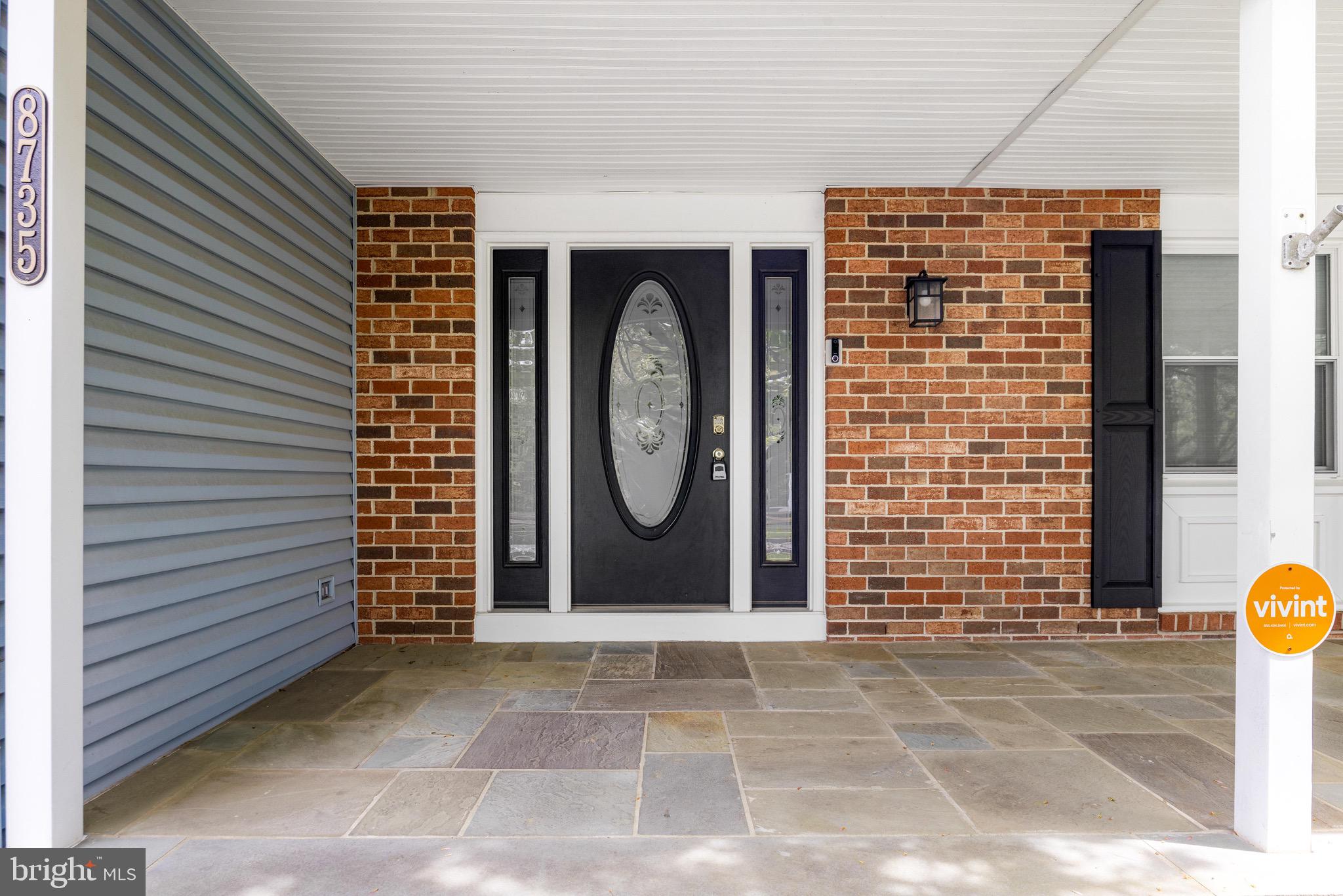 8735 Doves Fly Way Laurel, MD 20723 - Photo 61 of 64 a front view of a house with a garden