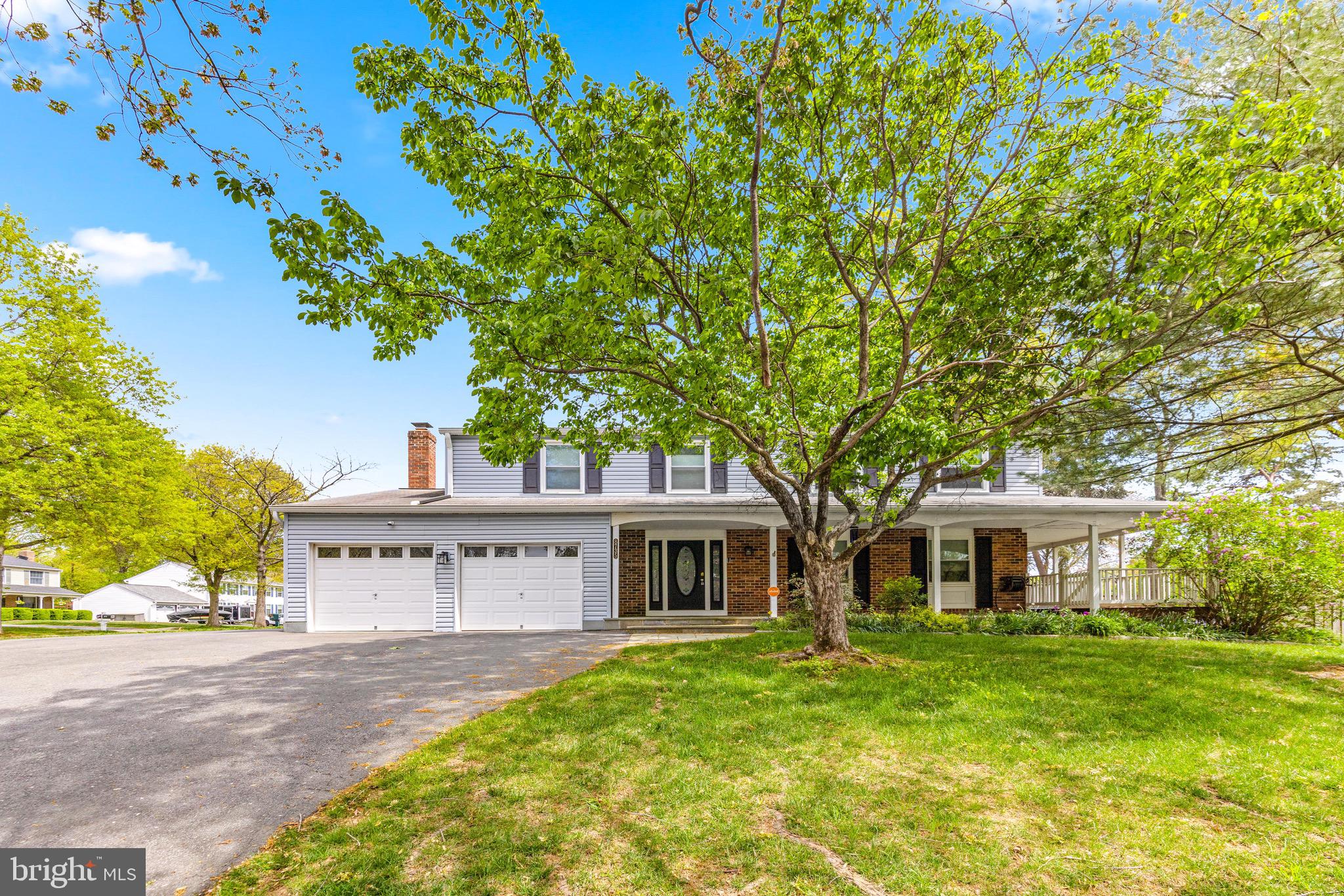 8735 Doves Fly Way Laurel, MD 20723 - Photo 63 of 64 a view of a house with a large tree and a yard