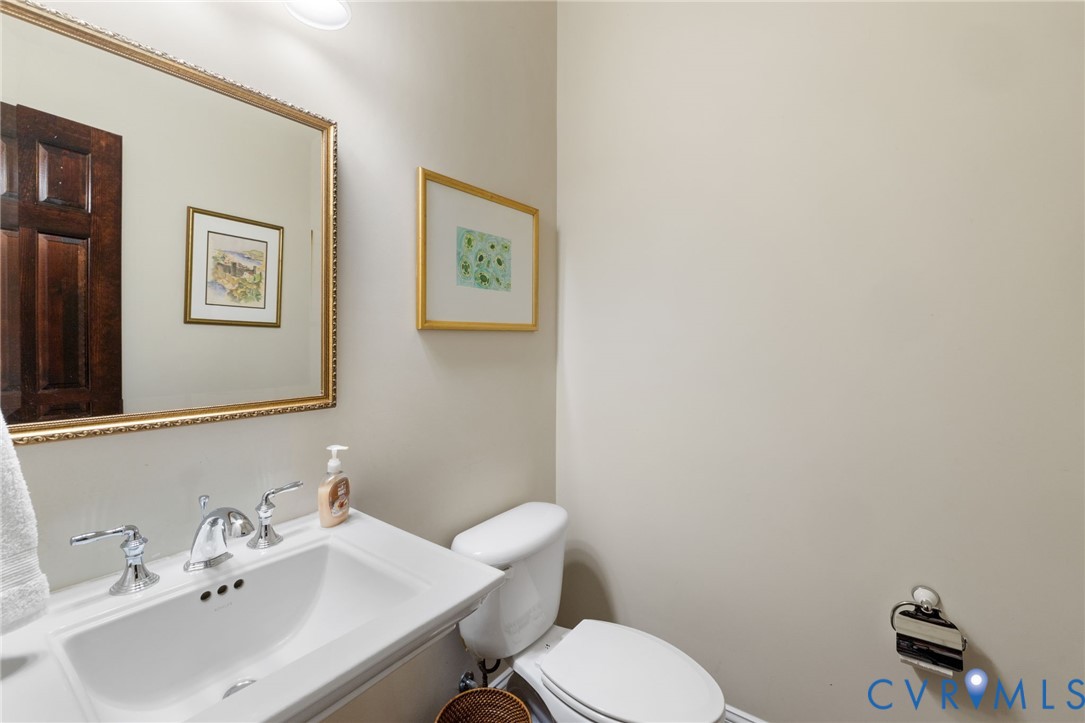 13173 Scotchtown Road Beaverdam, VA 23015 - Photo 33 of 65 a bathroom with a sink mirror and toilet