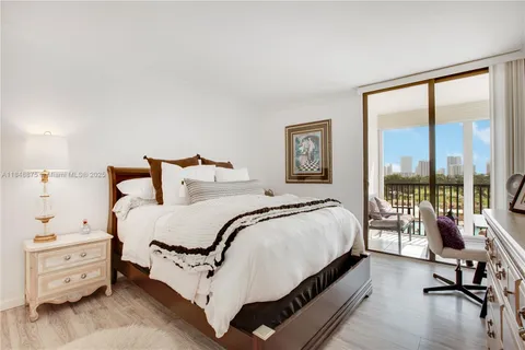 a bed room with a bed and a night stand