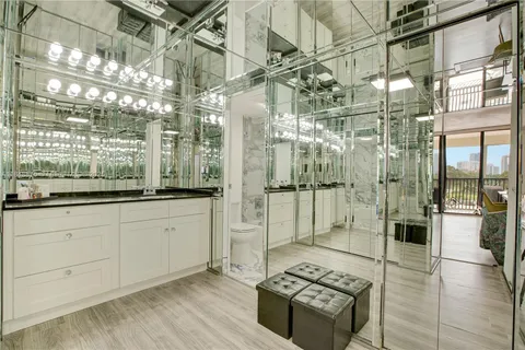 a open kitchen with stainless steel appliances granite countertop a stove and shower