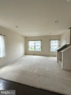 a view of empty room with windows