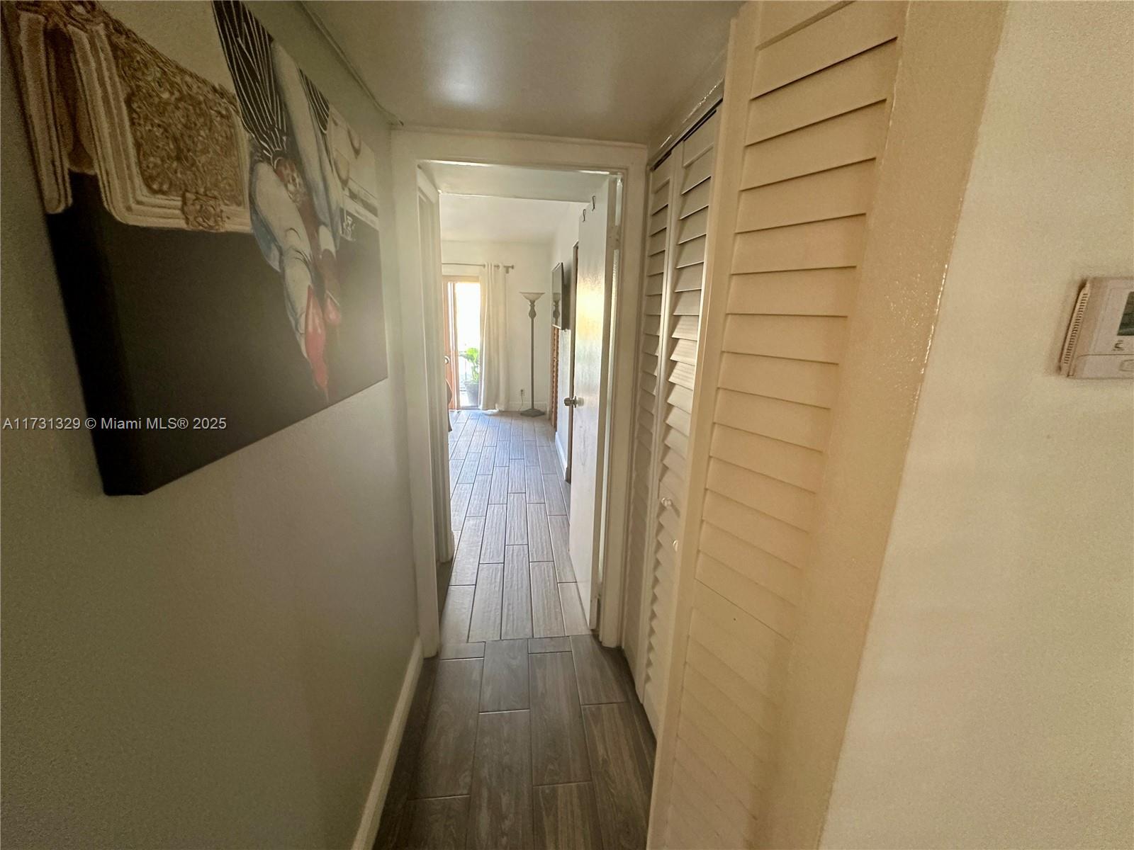 17911 Northwest 68th Avenue, Unit M106 Hialeah, FL 33015 - Photo 17 of 43 a view of a hallway