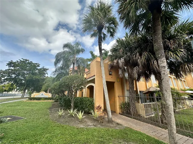 a view of a yard in front of a house