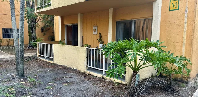 a view of a pathway with a house in the background