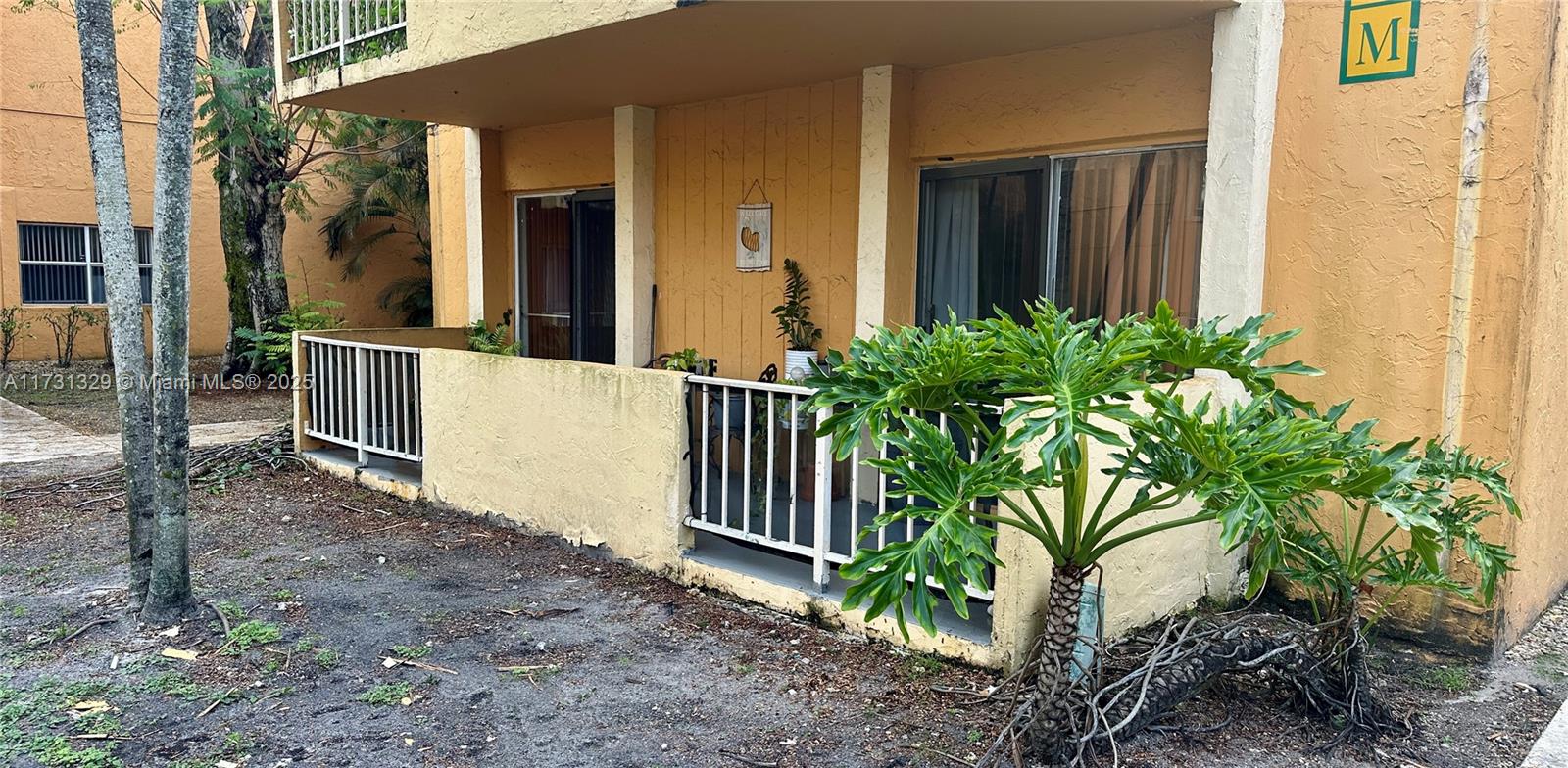 17911 Northwest 68th Avenue, Unit M106 Hialeah, FL 33015 - Photo 32 of 43 a porch with seating space