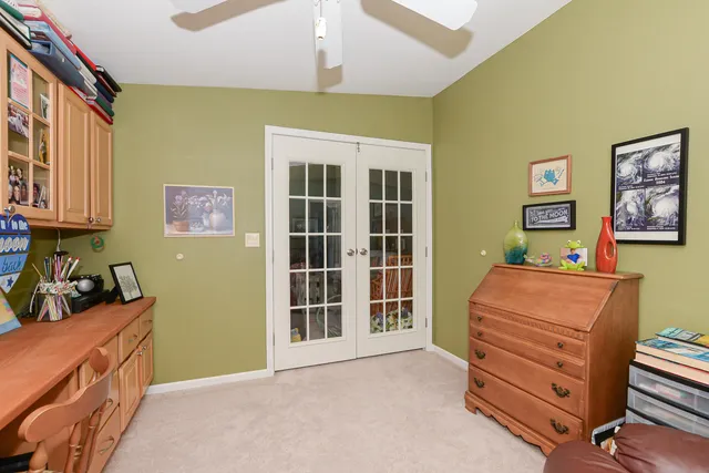 a bedroom with furniture and a flat screen tv