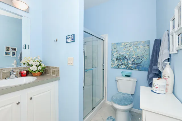 a dining room with chandelier front door and furniture