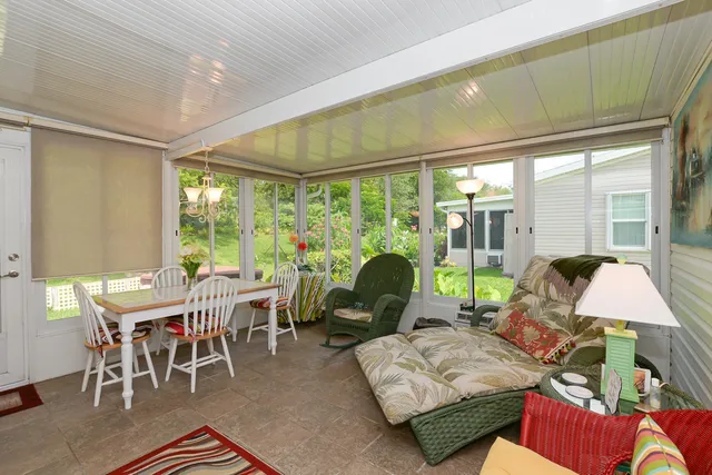 a front view of a house with a garden and patio