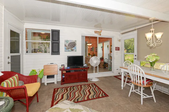 a view of a swimming pool with a lawn chairs