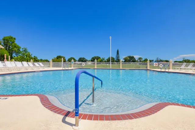 a view of a lake with houses in the background