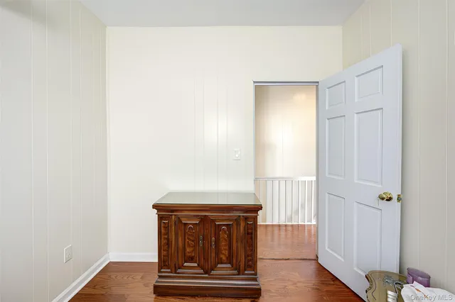 a view of front door with wooden floor