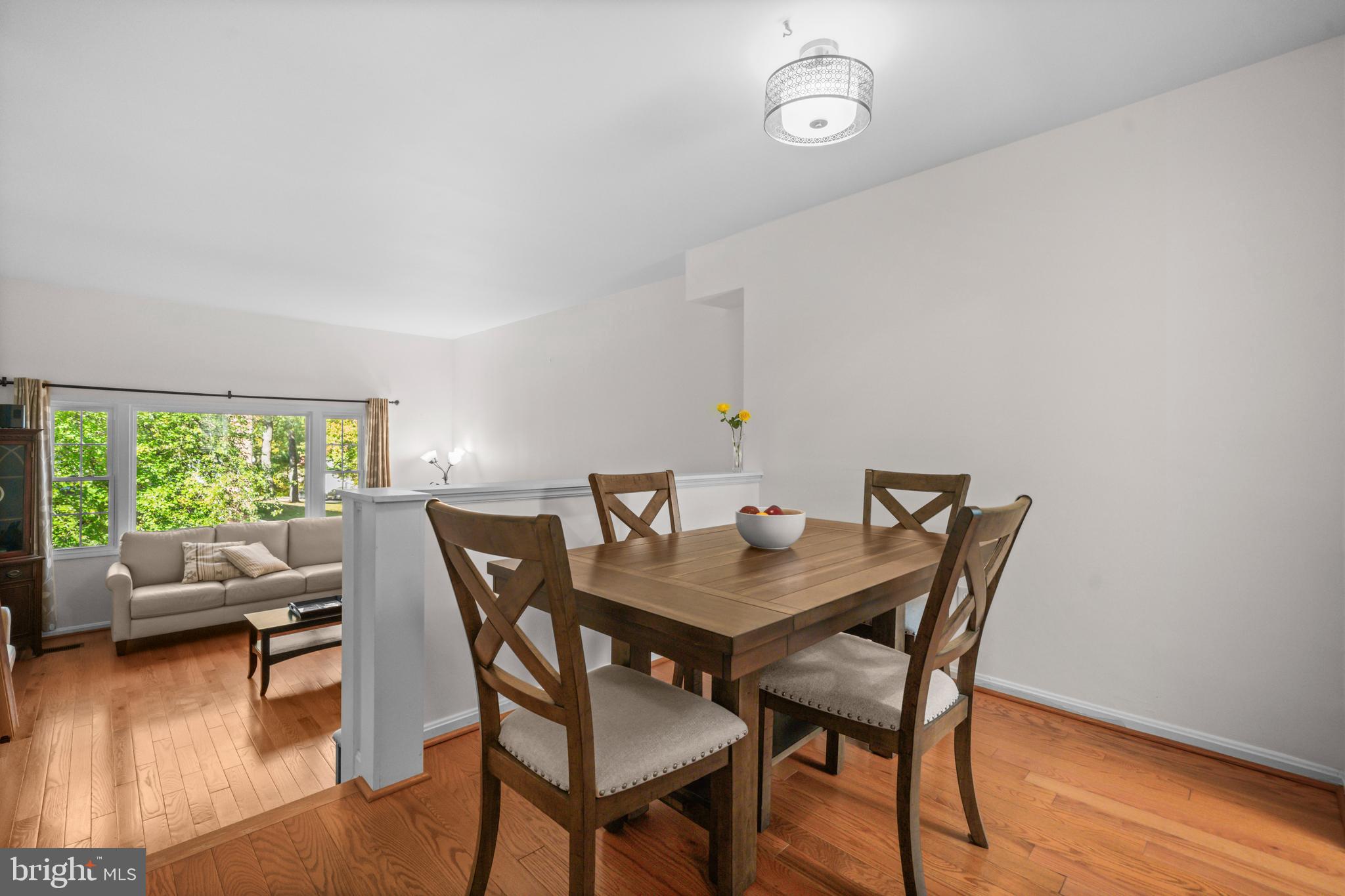 5824 Rexford Drive, Unit 731 Springfield, VA 22152 - Photo 12 of 30 a view of a dining room with furniture and wooden floor
