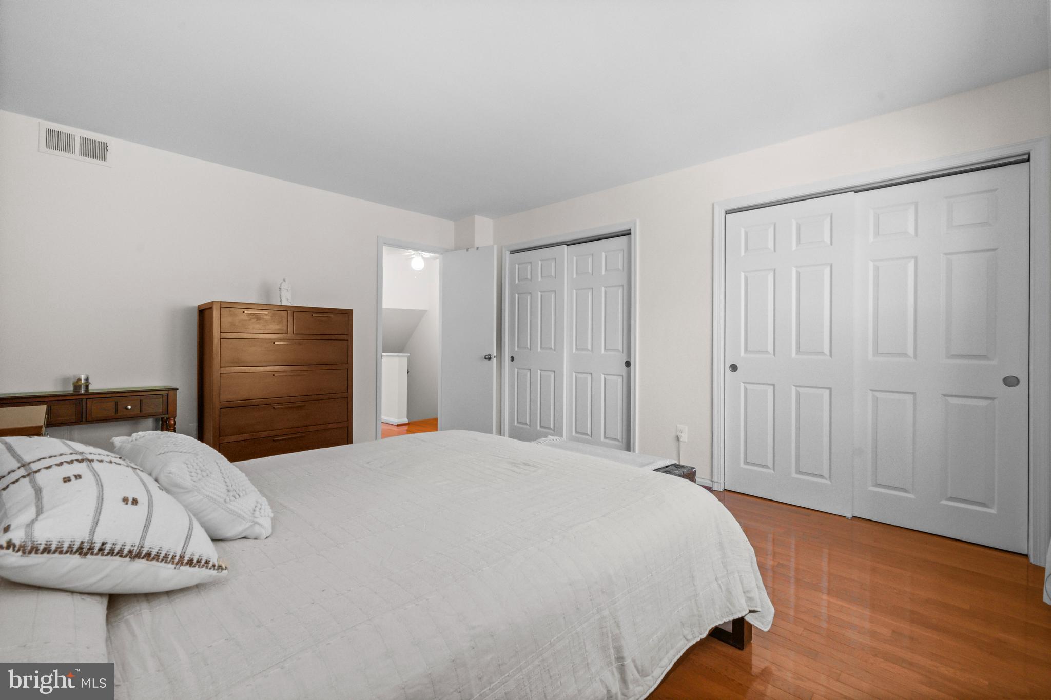 5824 Rexford Drive, Unit 731 Springfield, VA 22152 - Photo 16 of 30 a bedroom with a bed and a painting on the wall