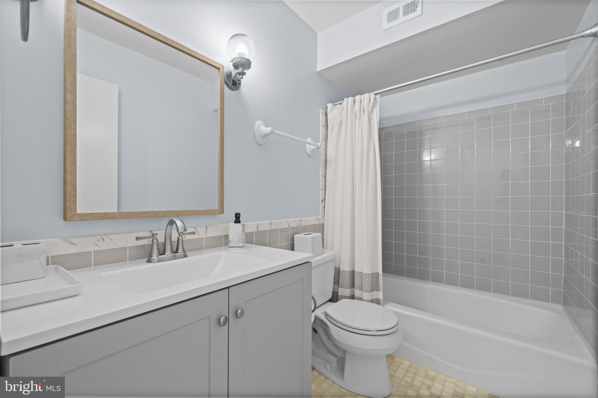 5824 Rexford Drive, Unit 731 Springfield, VA 22152 - Photo 17 of 30 a bathroom with a sink a toilet and shower