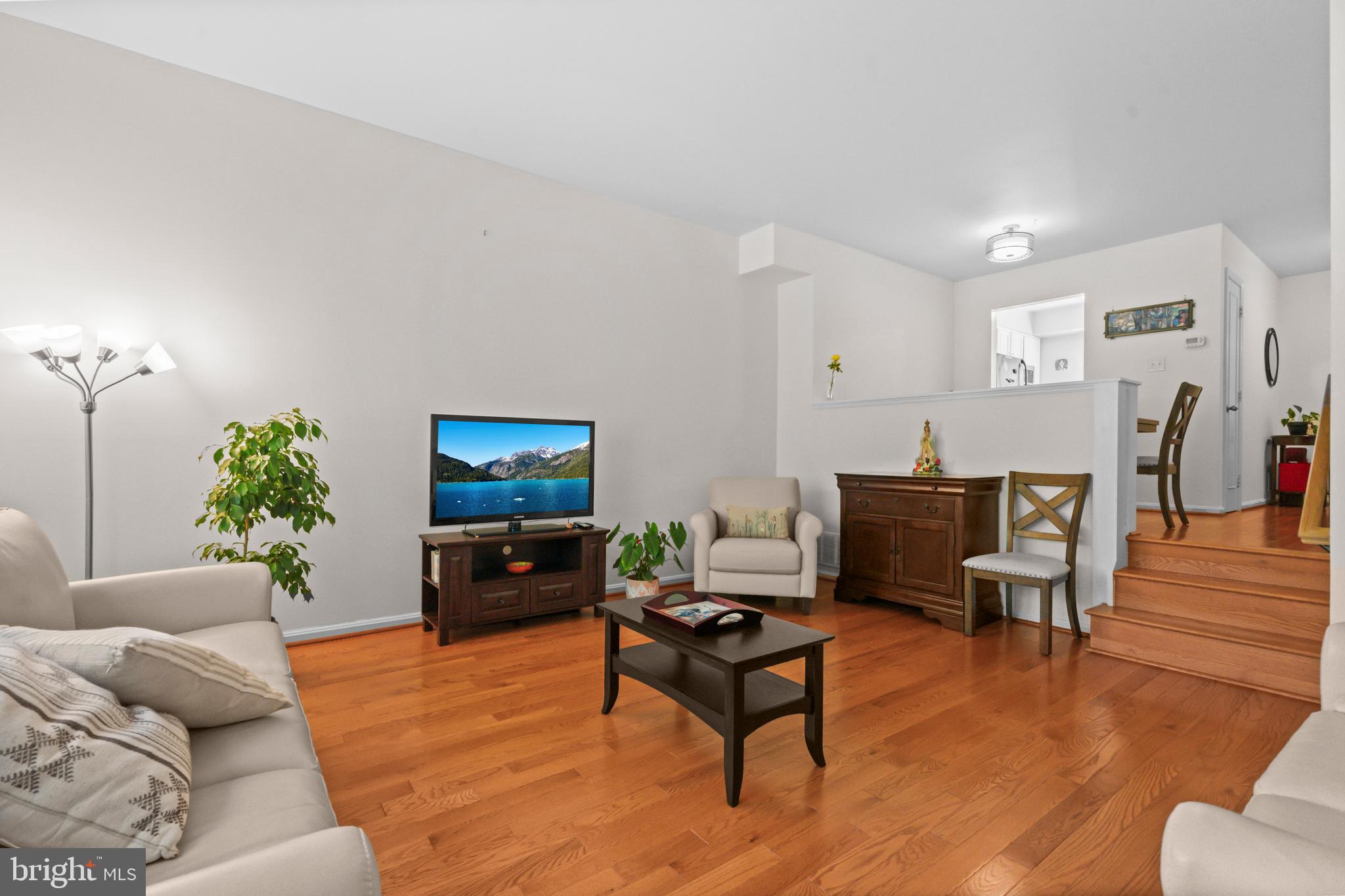 5824 Rexford Drive, Unit 731 Springfield, VA 22152 - Photo 7 of 30 a living room with furniture and a flat screen tv
