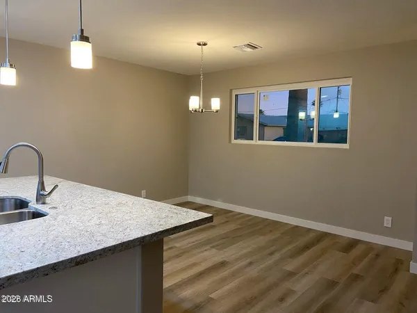a kitchen with a sink a counter space and a window