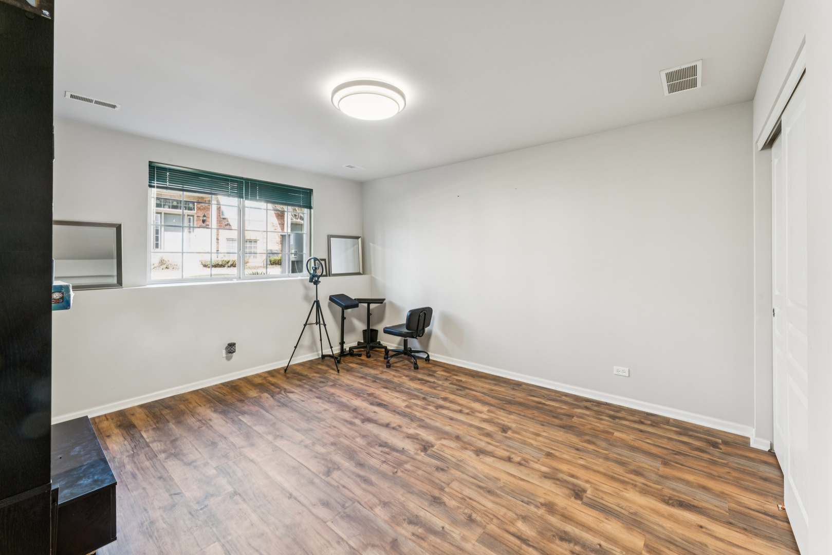 464 Valentine Way Oswego, IL 60543 - Photo 12 of 30 a workspace with wooden floor and a window