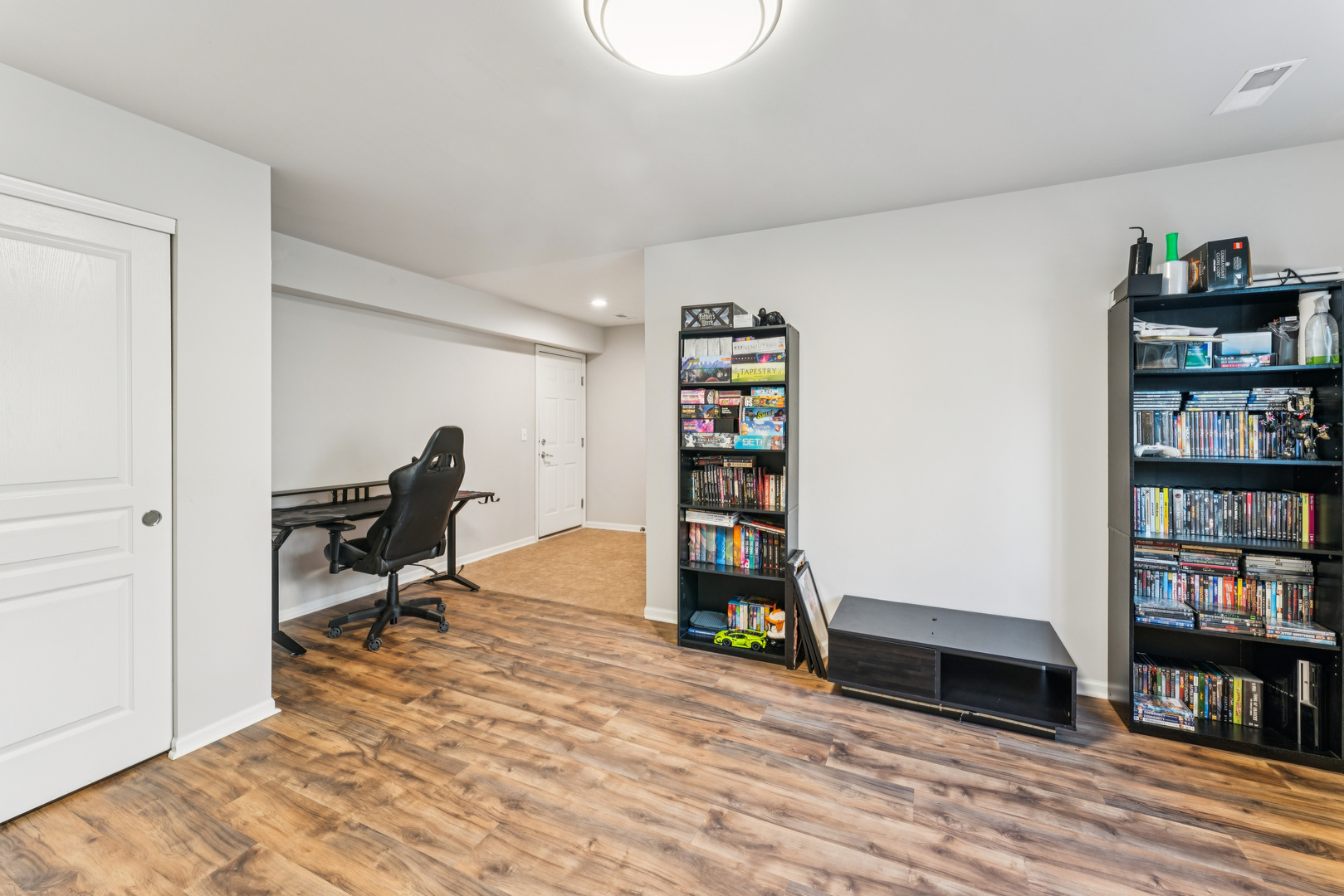 464 Valentine Way Oswego, IL 60543 - Photo 13 of 30 a view of a workspace with furniture and wooden floor