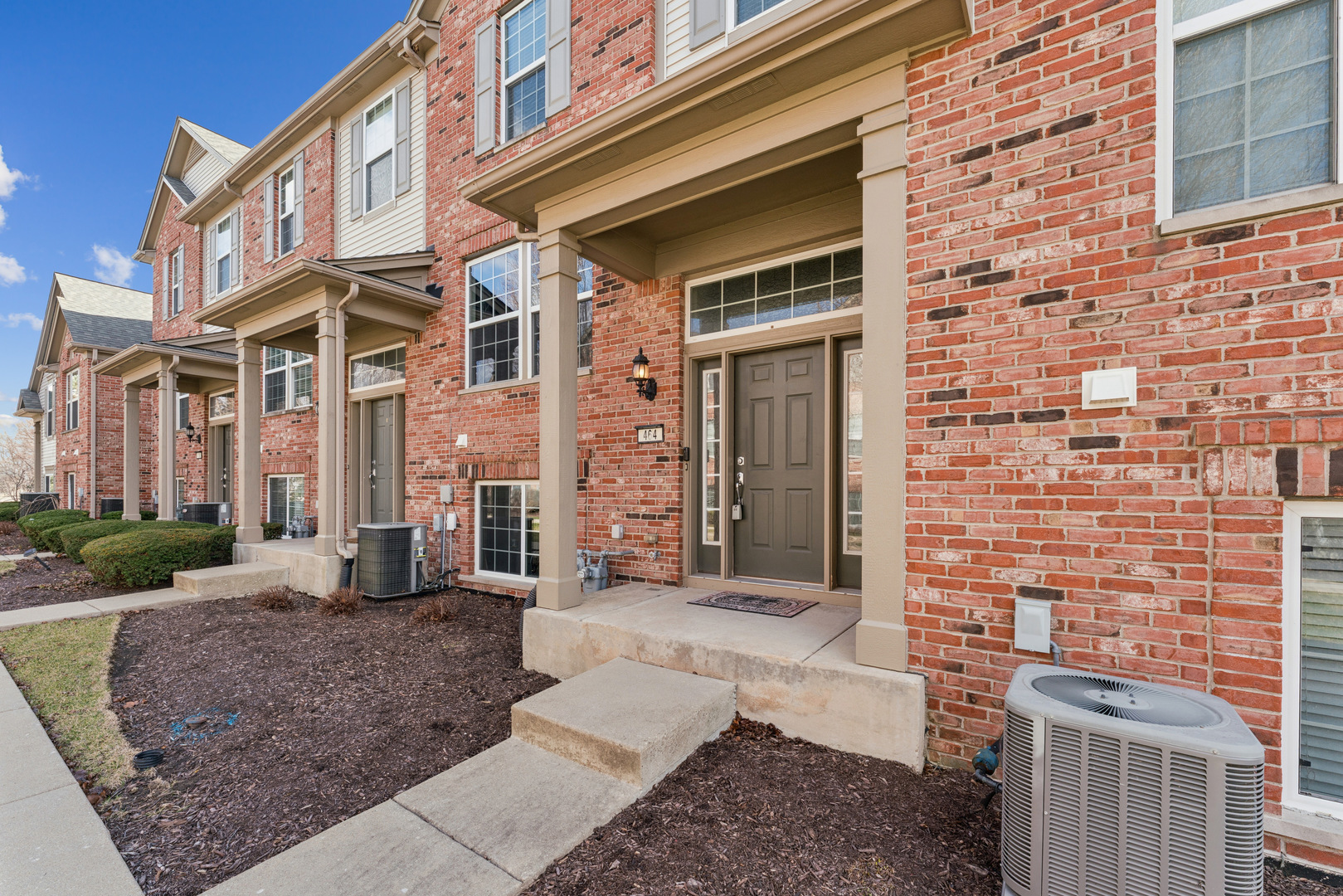 464 Valentine Way Oswego, IL 60543 - Photo 2 of 30 a view of a brick building with many windows