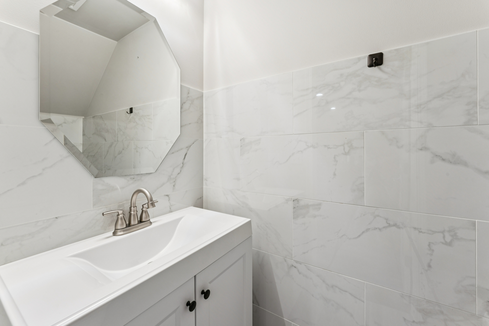 464 Valentine Way Oswego, IL 60543 - Photo 23 of 30 a bathroom with a sink and a mirror