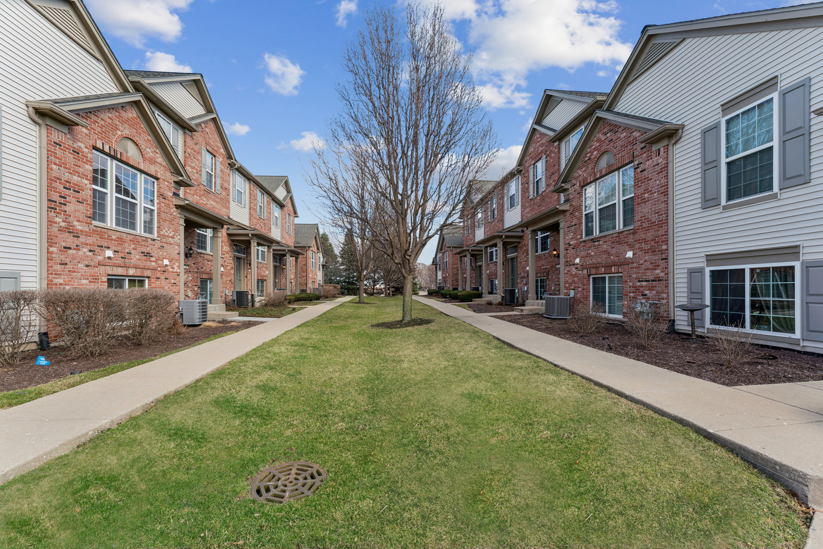 464 Valentine Way Oswego, IL 60543 - Photo 29 of 30 a view of a building with a yard