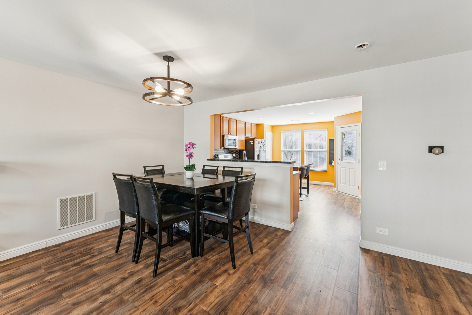 464 Valentine Way Oswego, IL 60543 - Photo 7 of 30 a view of a dining room with furniture window and wooden floor