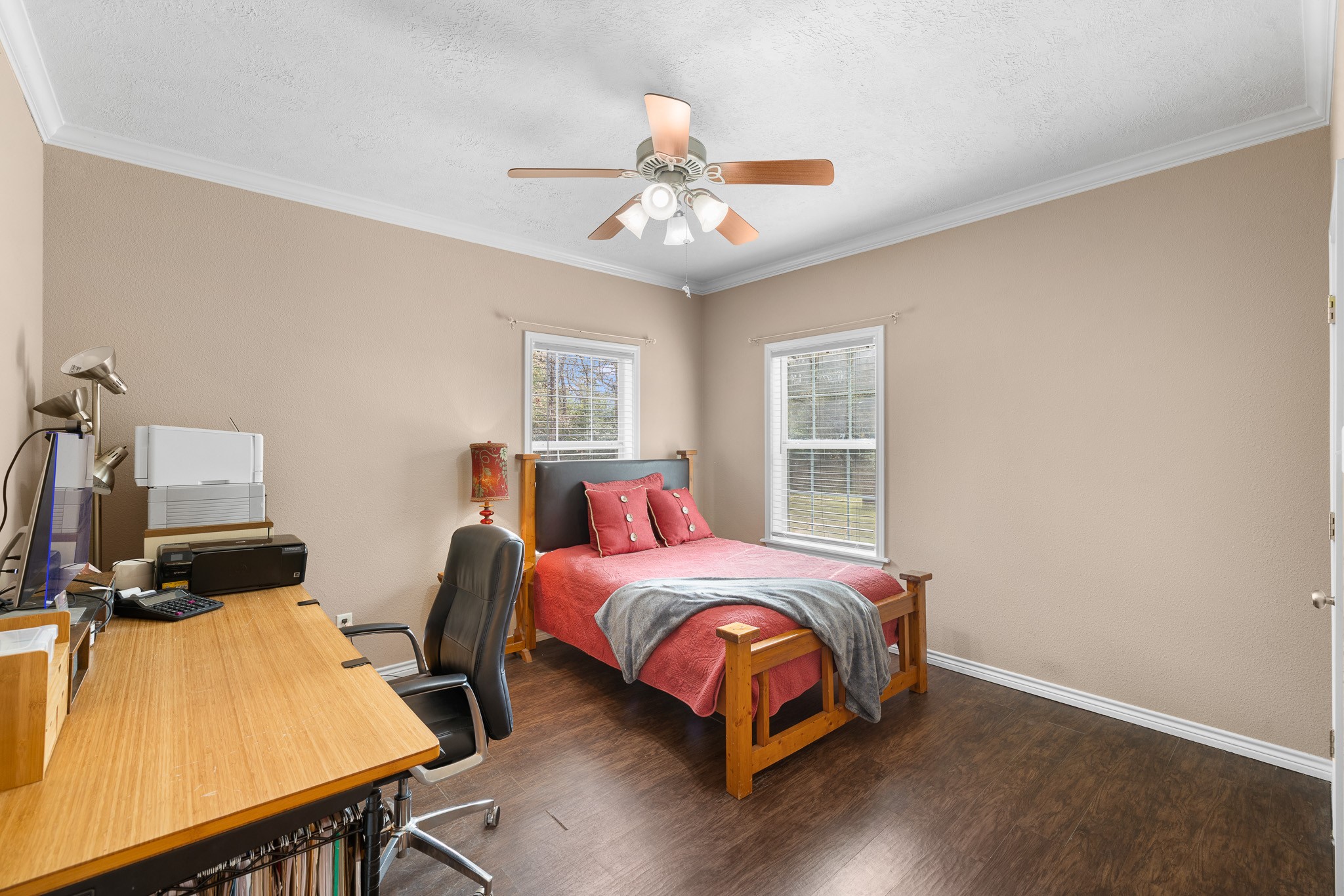 4196 Winding Road Hearne, TX 77859 - Photo 11 of 33 a bedroom with a bed and wooden floor
