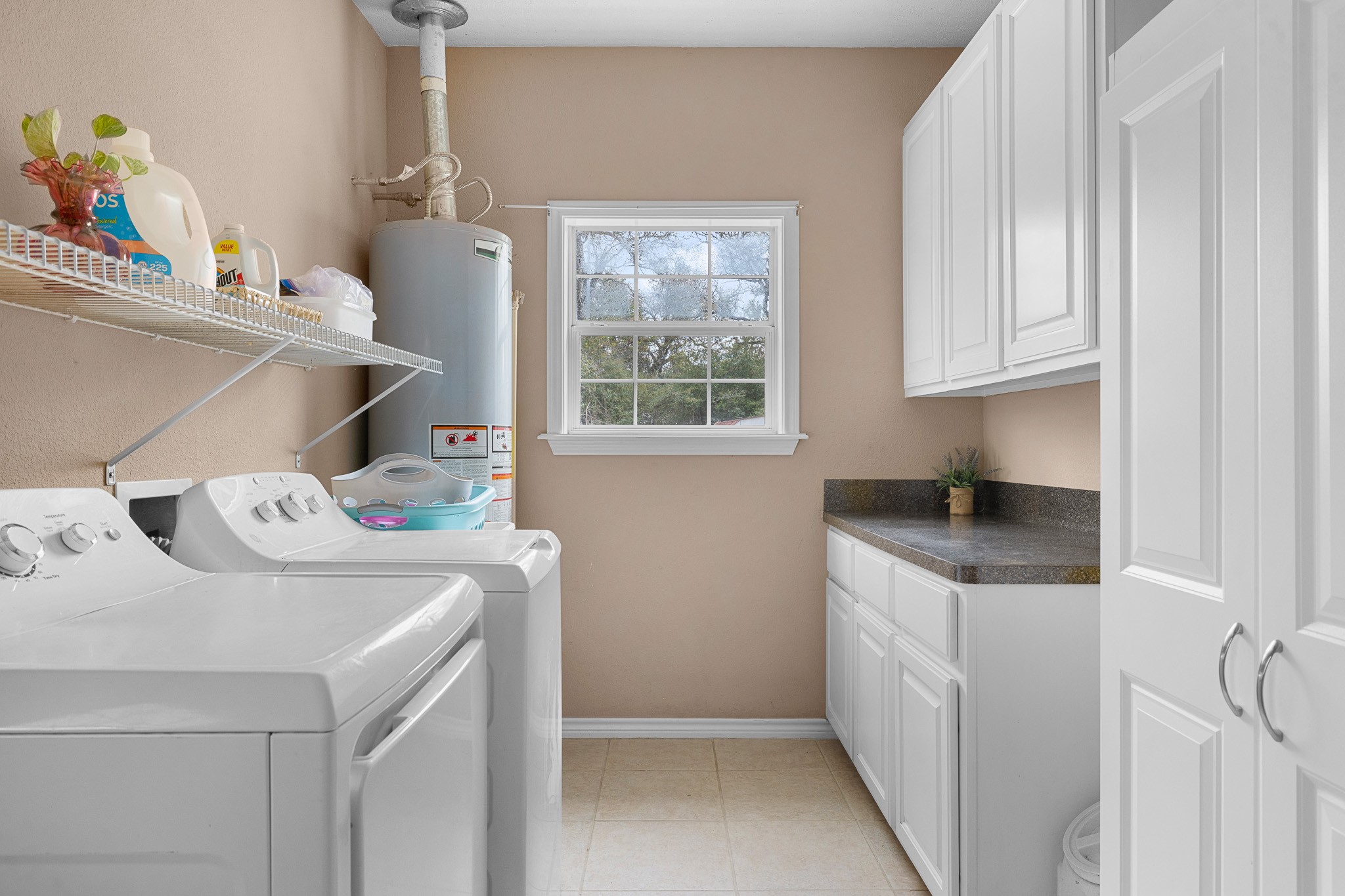 4196 Winding Road Hearne, TX 77859 - Photo 14 of 33 a utility room with sink dryer and washer