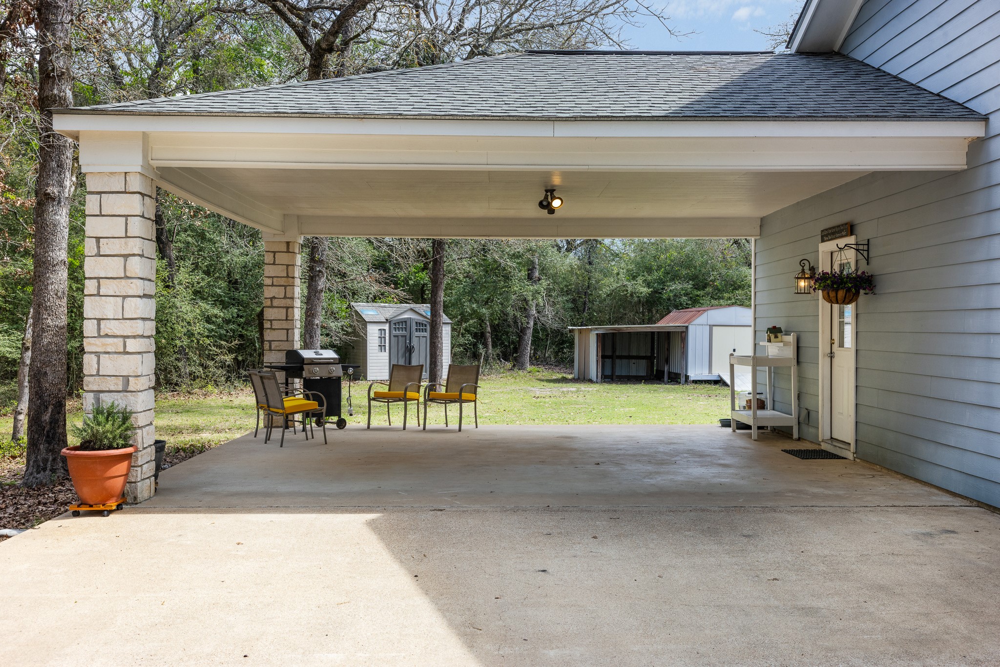 4196 Winding Road Hearne, TX 77859 - Photo 16 of 33 a view of a porch with furniture and a yard