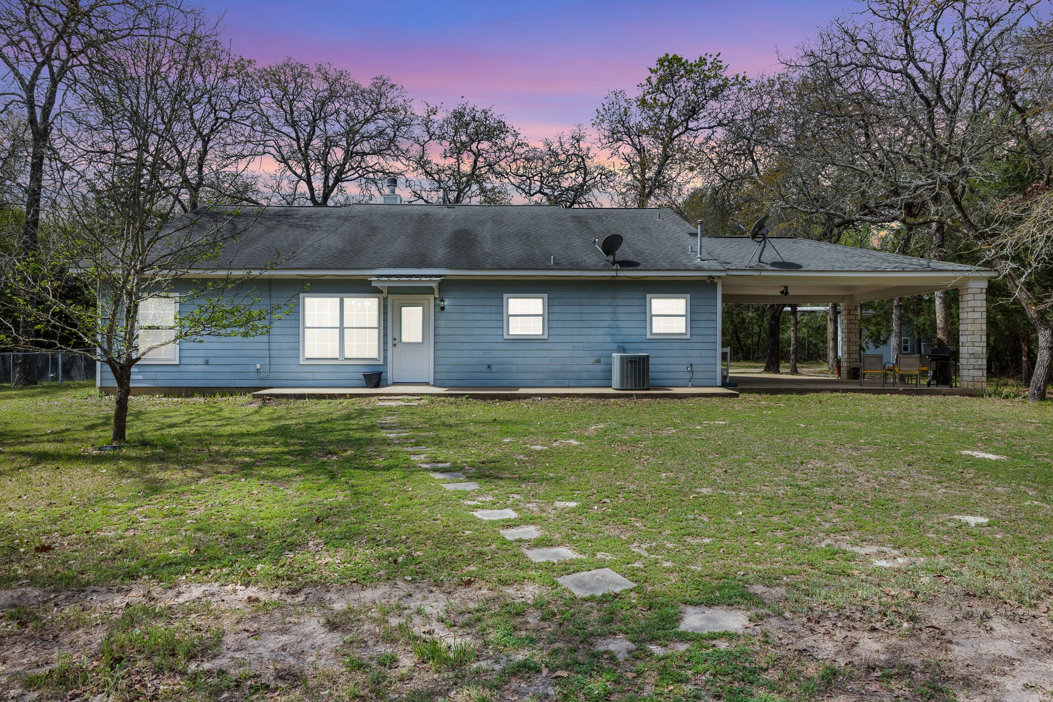 4196 Winding Road Hearne, TX 77859 - Photo 20 of 33 a front view of a house with a garden