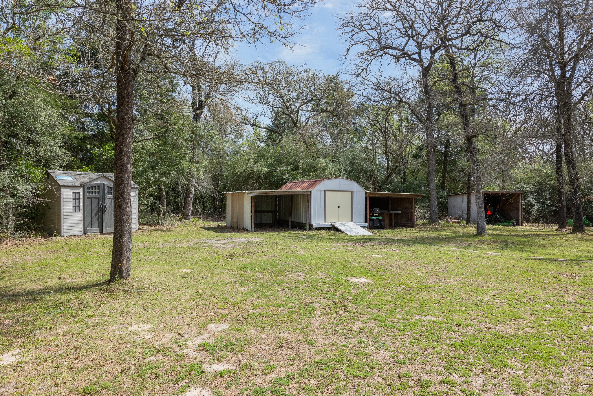 4196 Winding Road Hearne, TX 77859 - Photo 21 of 33 a front view of a house with a yard garage and outdoor seating