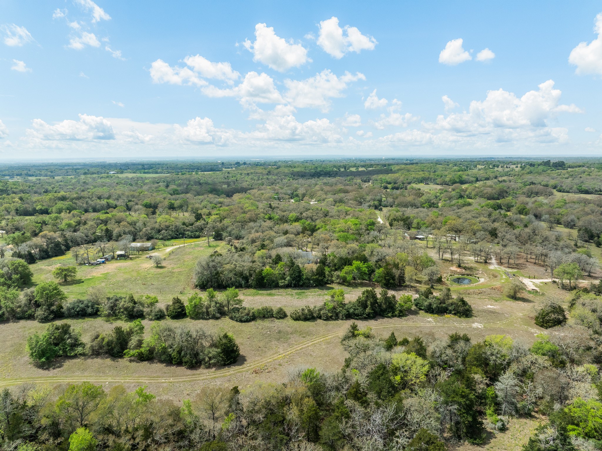 4196 Winding Road Hearne, TX 77859 - Photo 29 of 33 a view of a bunch of trees and houses