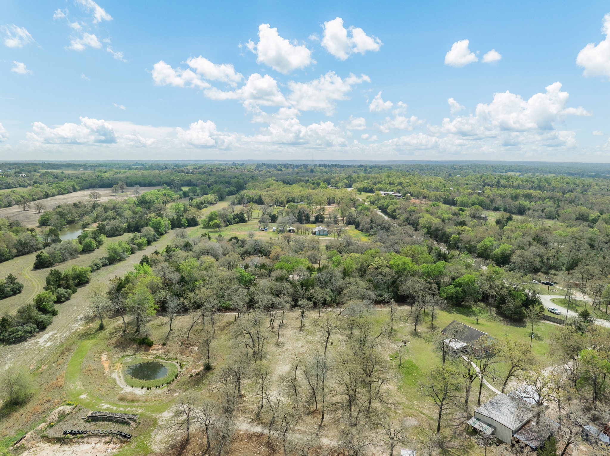 4196 Winding Road Hearne, TX 77859 - Photo 30 of 33 an aerial view of residential houses with outdoor space and trees