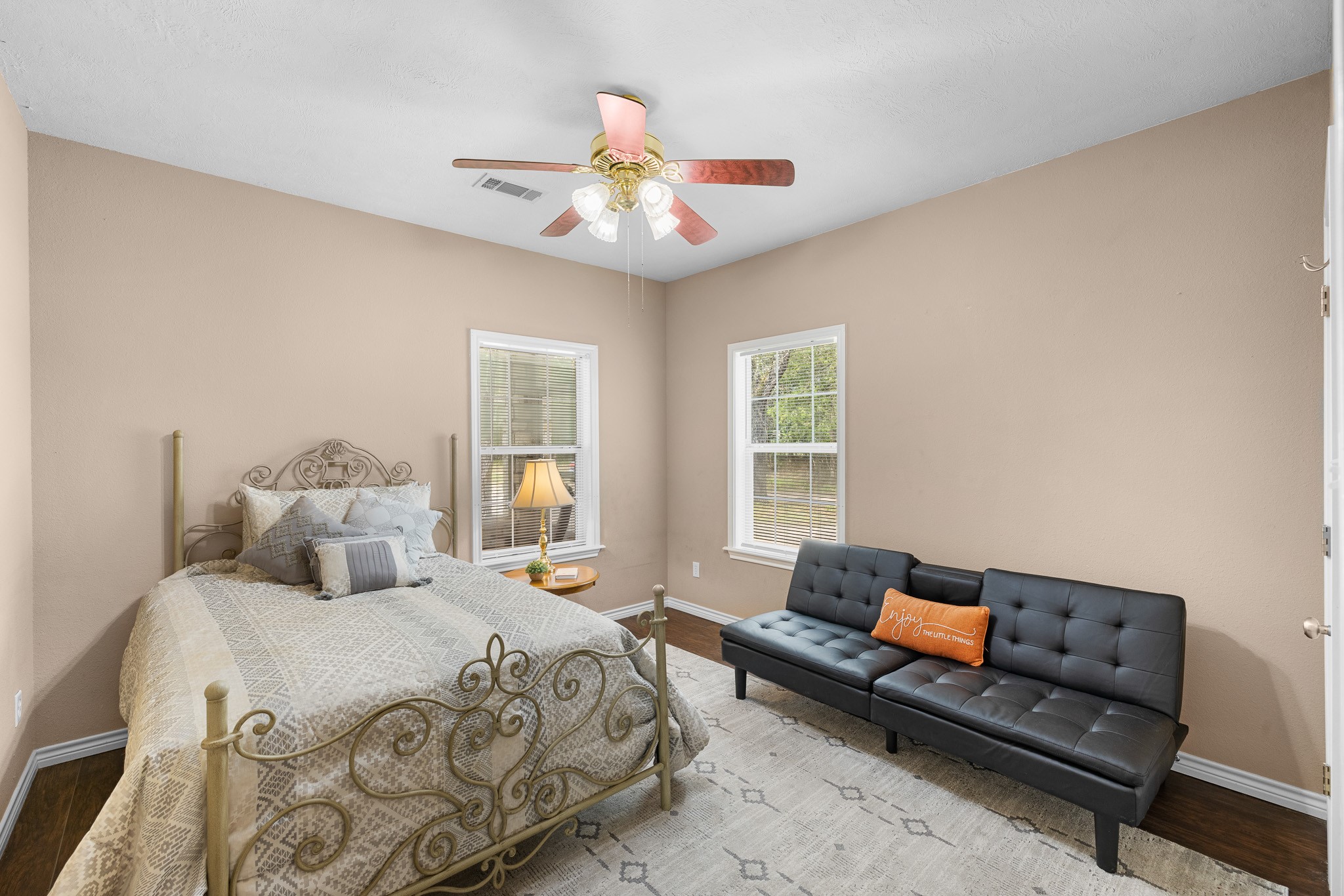 4196 Winding Road Hearne, TX 77859 - Photo 10 of 33 a bedroom with a bed couch and window