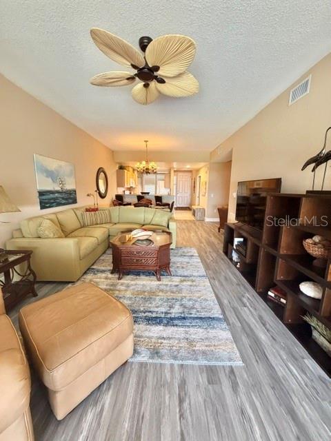 13413 Gasparilla Road, Unit 304 Placida, FL 33946 - Photo 7 of 28 a living room with furniture and a wooden floor