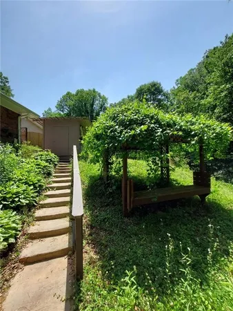 a backyard of a house with lots of green space