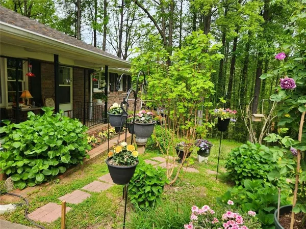a bunch of flowers in front of the house