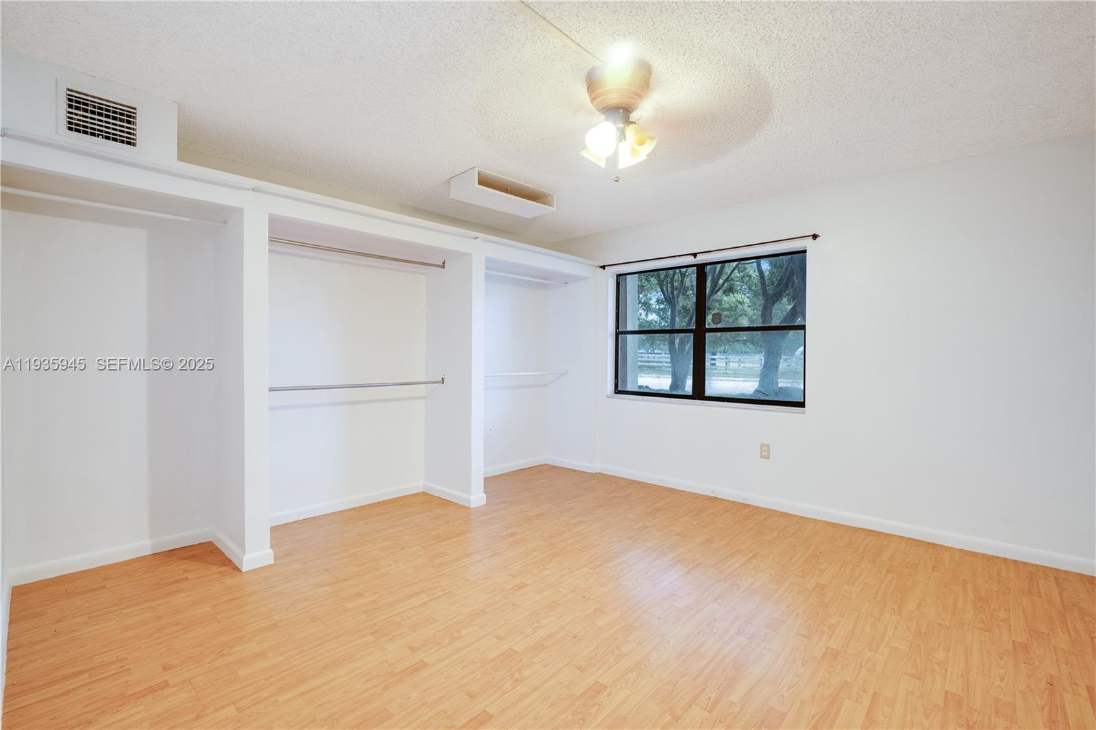 11483 Southwest 109th Road, Unit 2E Miami, FL 33176 - Photo 16 of 45 a view of an empty room with a window