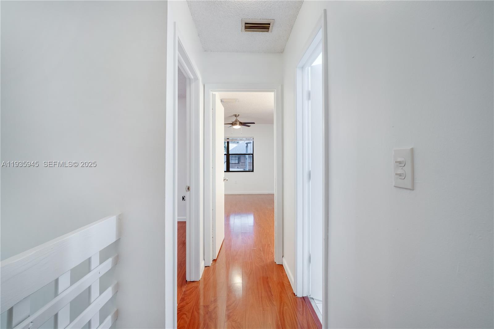 11483 Southwest 109th Road, Unit 2E Miami, FL 33176 - Photo 18 of 45 a view of a hallway with wooden floor
