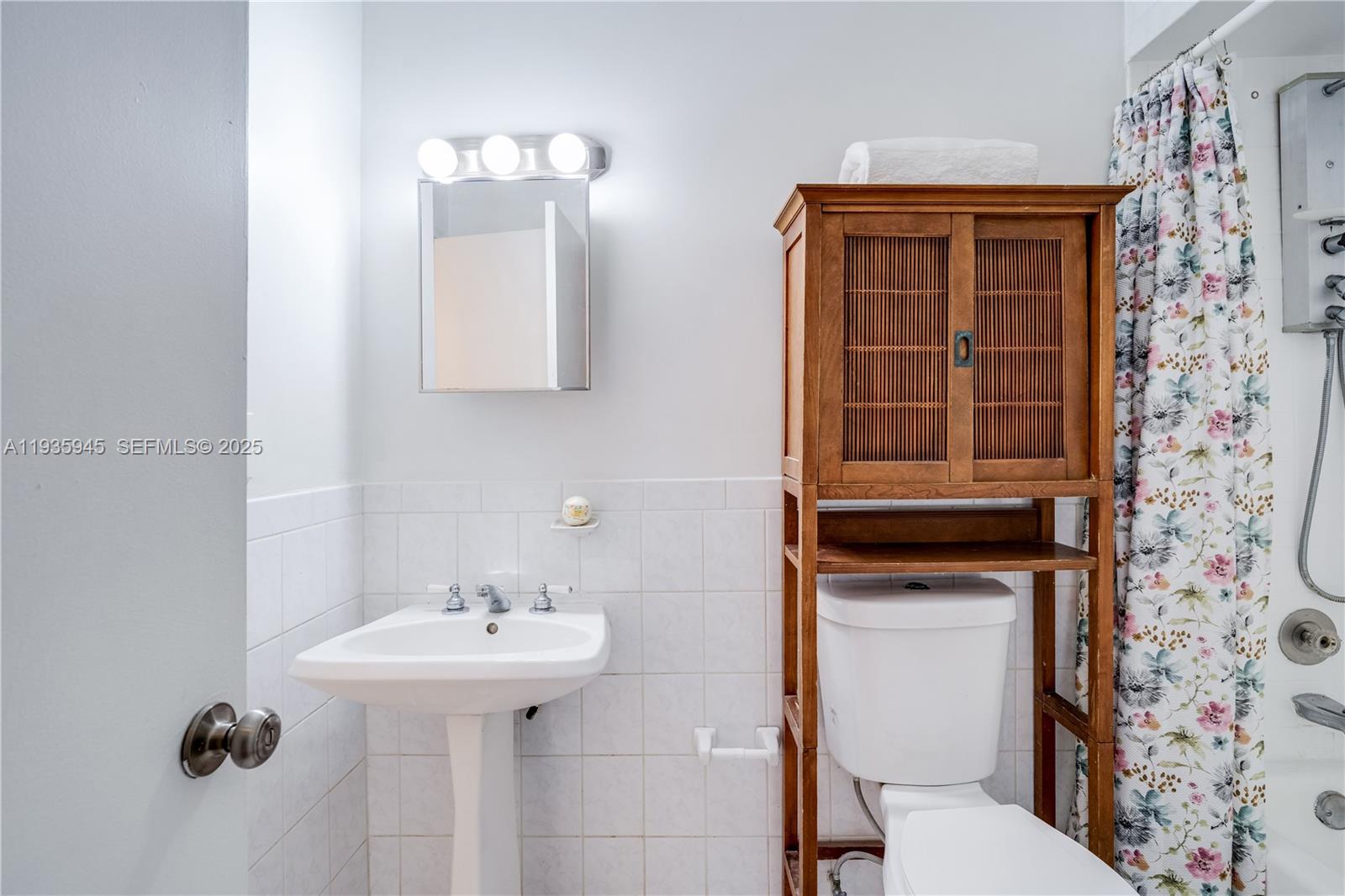11483 Southwest 109th Road, Unit 2E Miami, FL 33176 - Photo 20 of 45 a bathroom with a sink a toilet and shower